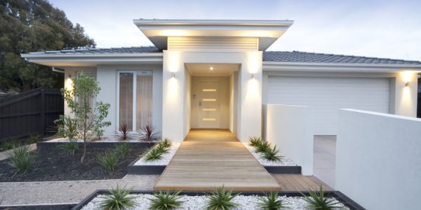 Front view of contemporary home in Australia Facade and entry to a contemporary white rendered home in Australia.